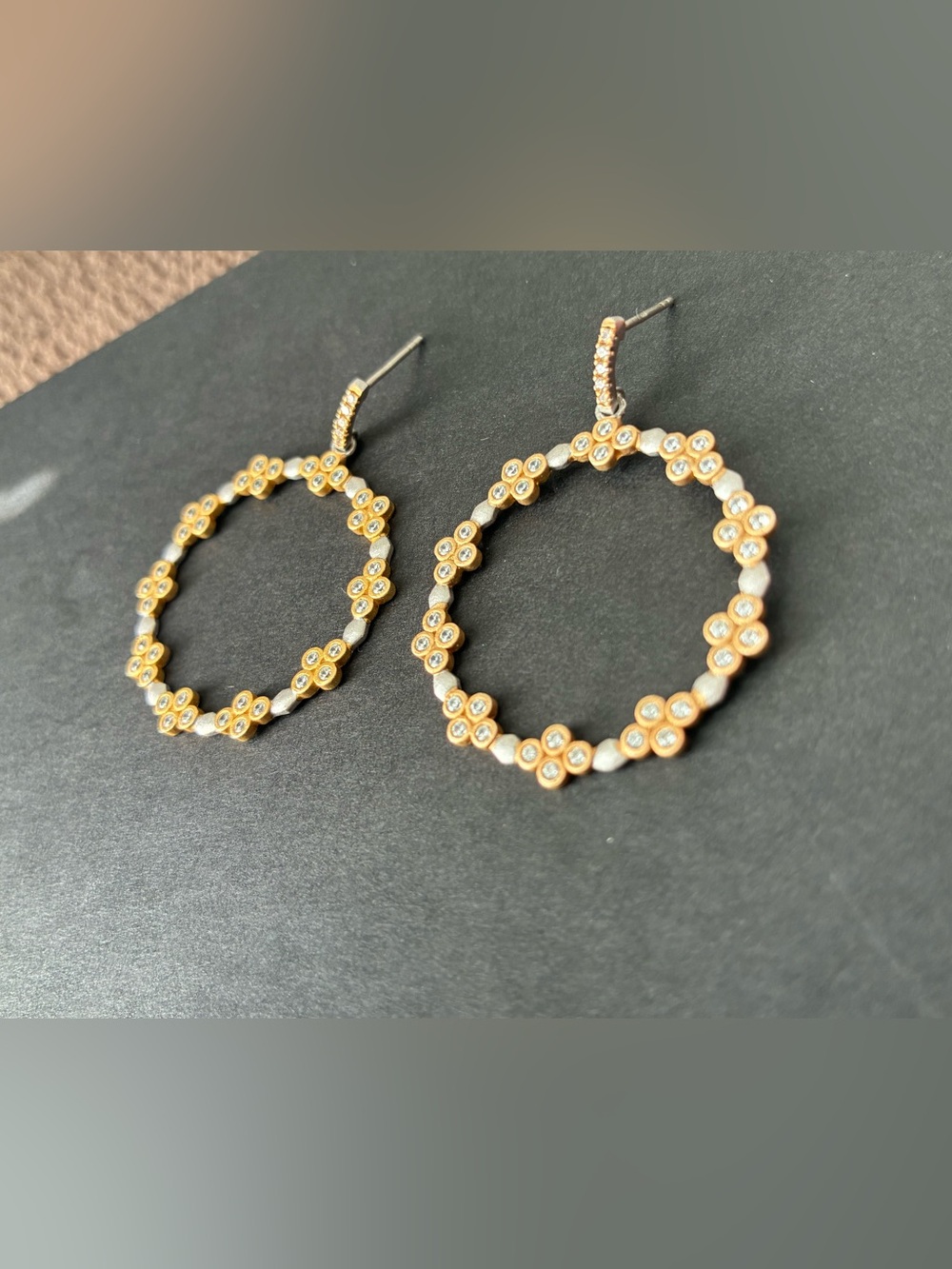Freida Rothman Armor of hope embellished clover open hoop earrings.
